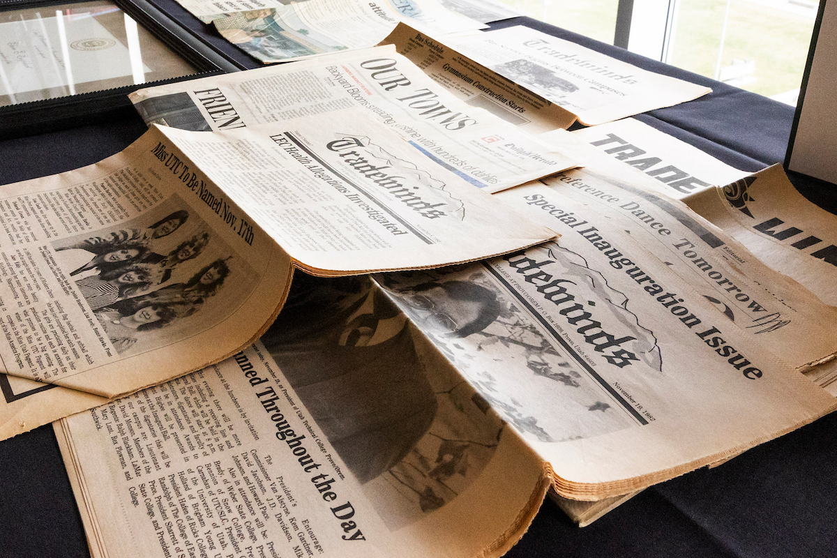 scattered newspapers on a desk