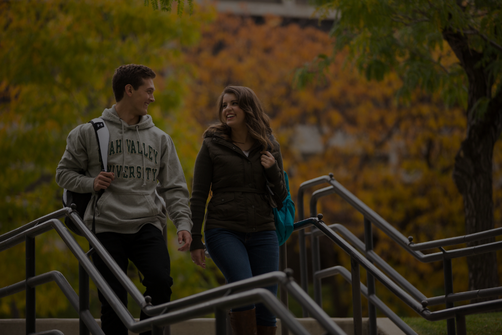 Two UVU students walking outside campus