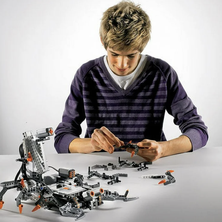 5th grader building with legos
