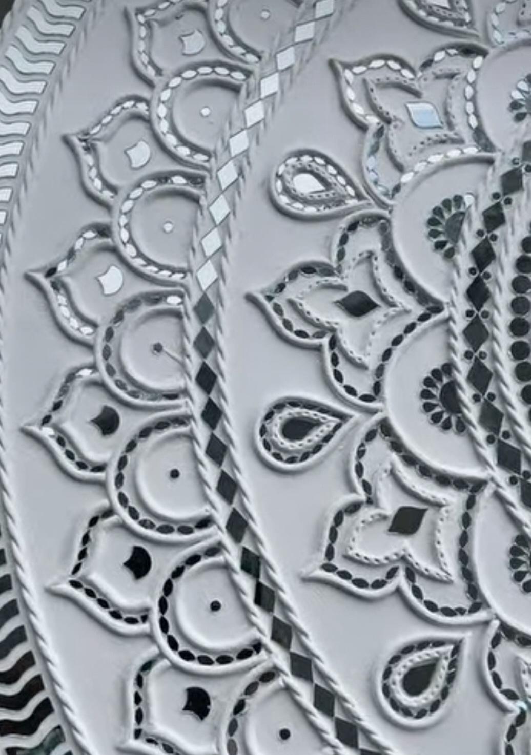 Portion of mud mirror with gorgeous detail.