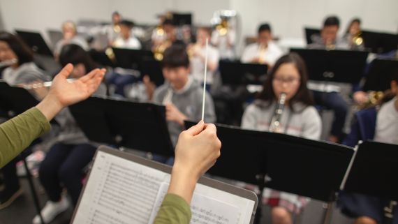 The POV of a conductor conducting a musical ensamble