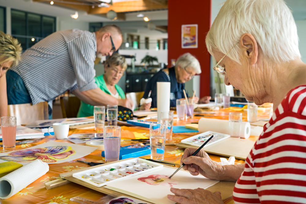 Elderly people in art class