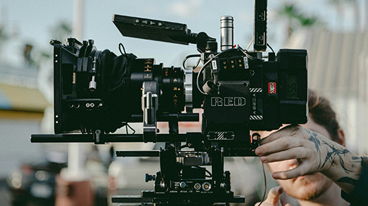 man directing a film