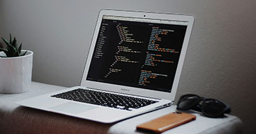 laptop with code on the screen