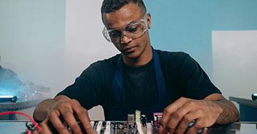man working on an electrical board