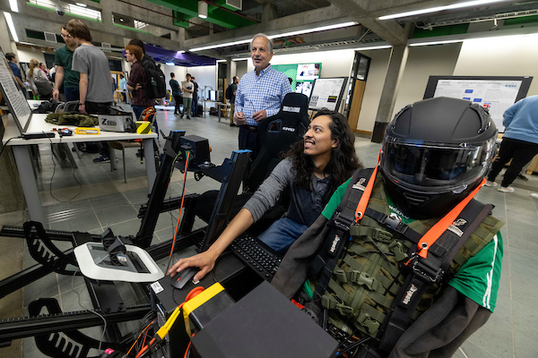 person using a video game racing set up