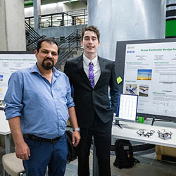 two people standing in front of a poster