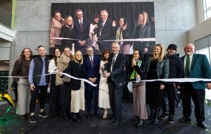 Ribbon Cutting Ceremony People Holding large scissors and Cutting a large ribbon in the Scott M. Smith Engineering Building