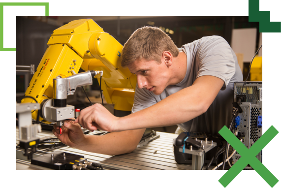 student working on a robotic machine