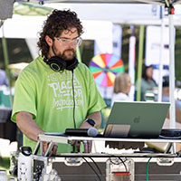 man with headphones using a laptop