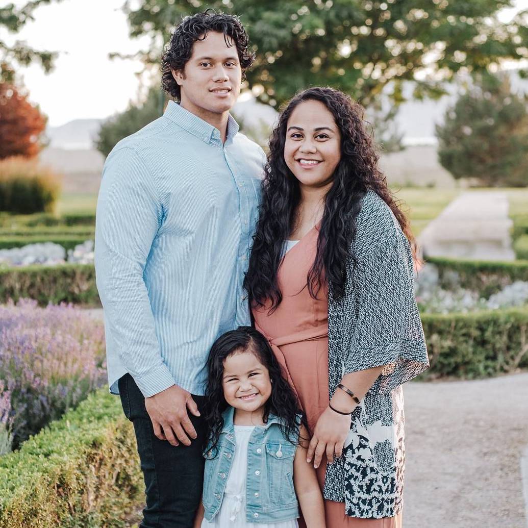 scholarship recipient with his wife and daughter