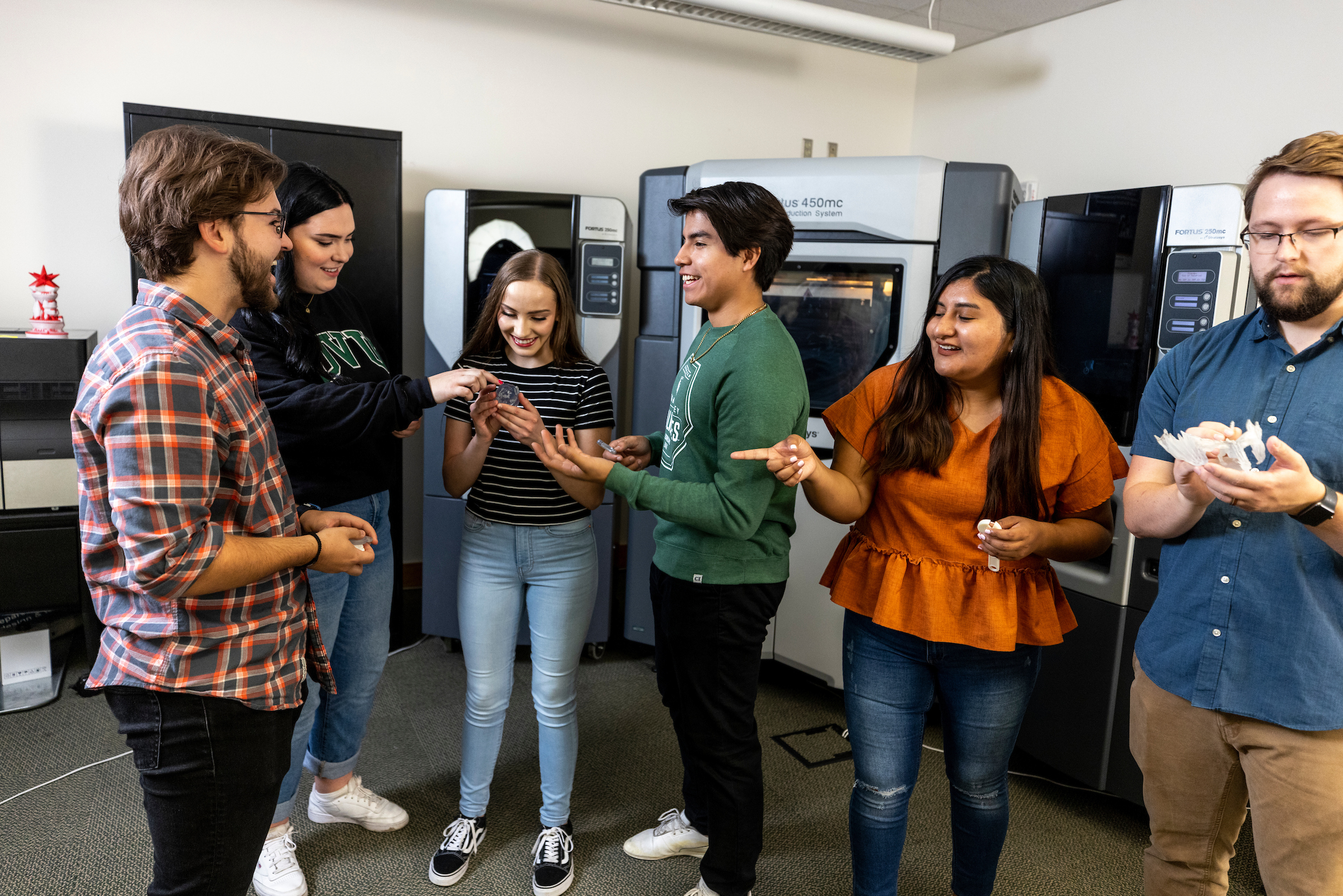 people in a group laughing and talking