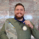 man holding a medal