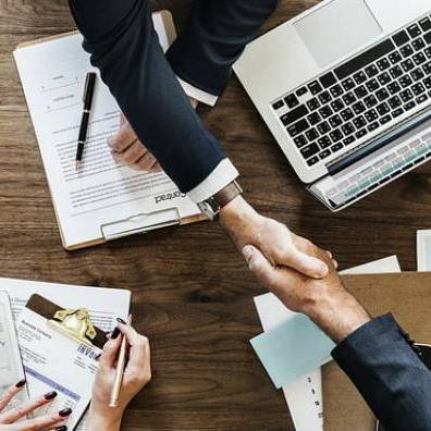 Two business people shaking hands