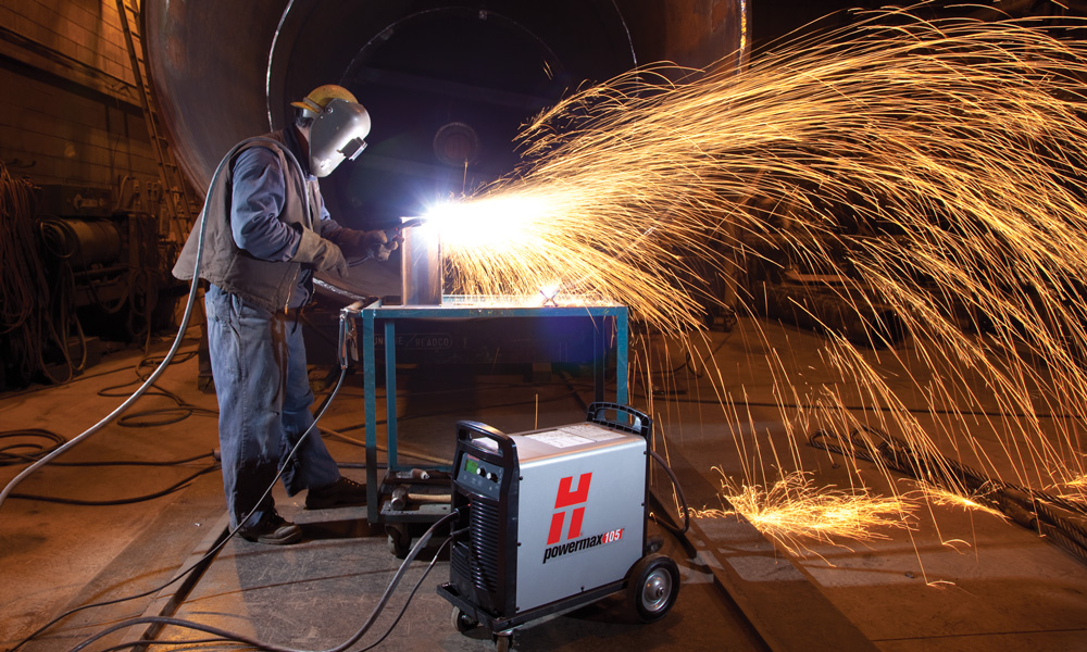 Man using a plasma cutter