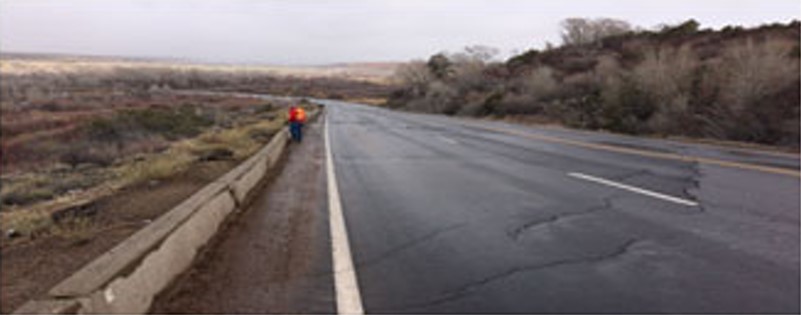 man working on the side of the road