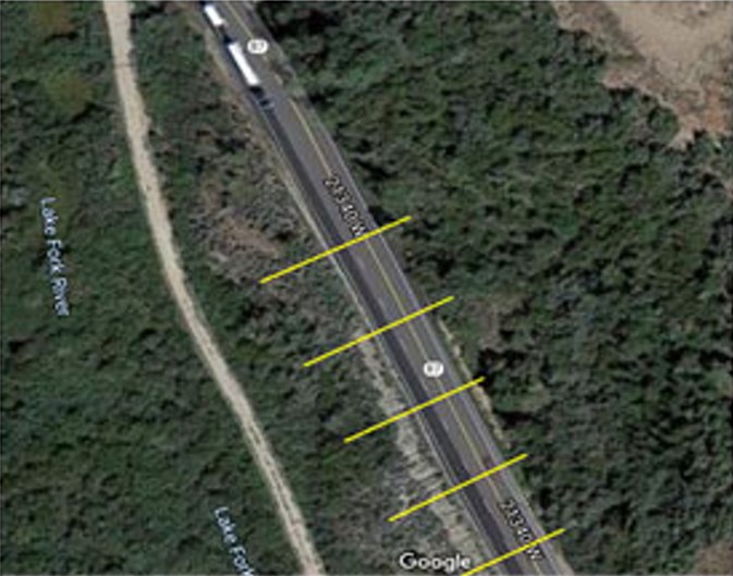 satellite view of a road with yellow markings
