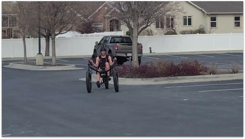 student riding a bicycle-like machine