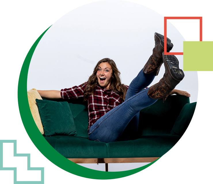 woman sitting on a green couch
