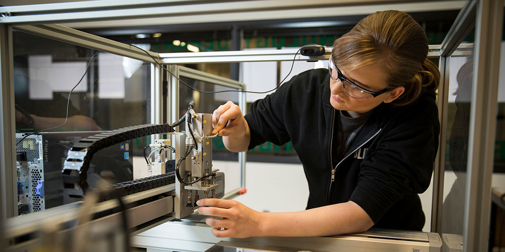woman working on a machine