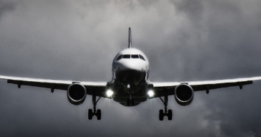 A picture of a plane from the front, looking down to the tail