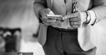 a person holds a notebook in their hands