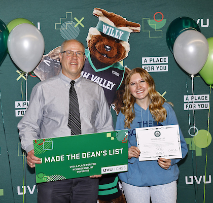 Dean posing with a student on the Dean's List