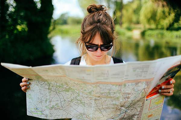 Explorer looking at a map