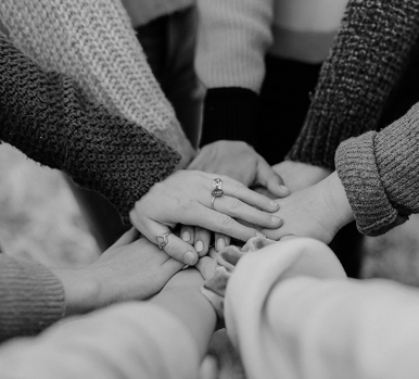 Group putting their hands together