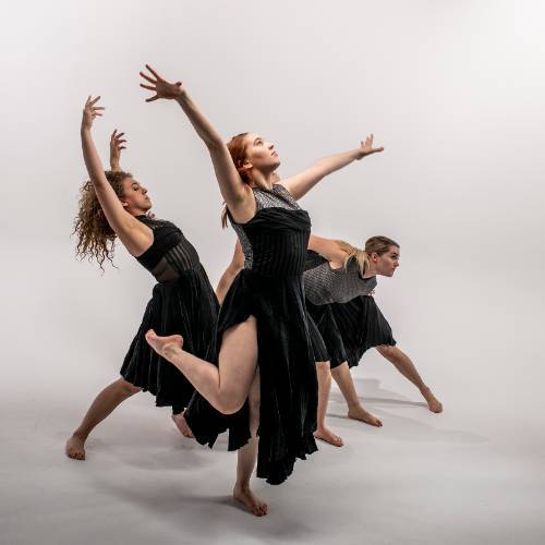 women dancing in black