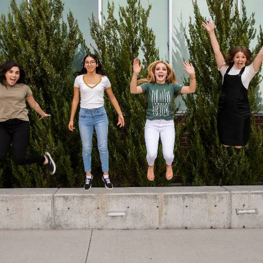 women jumping in the air