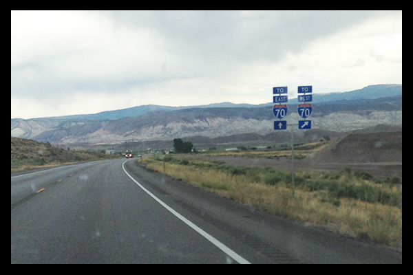 Signs for I-70 East and West on road side