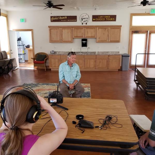 Student talking to the Rainbow Ranch caretaker