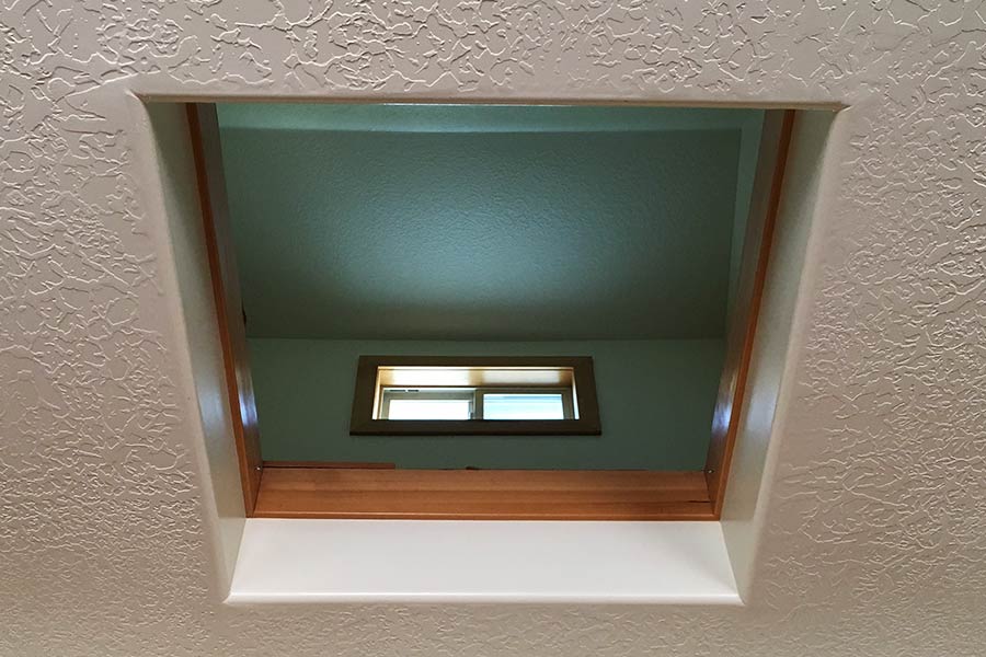 hole in ceiling to allow hot air to escape the building in the summer.