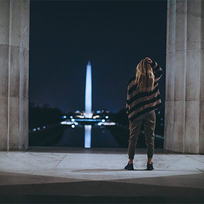 Woman standing with back to camera