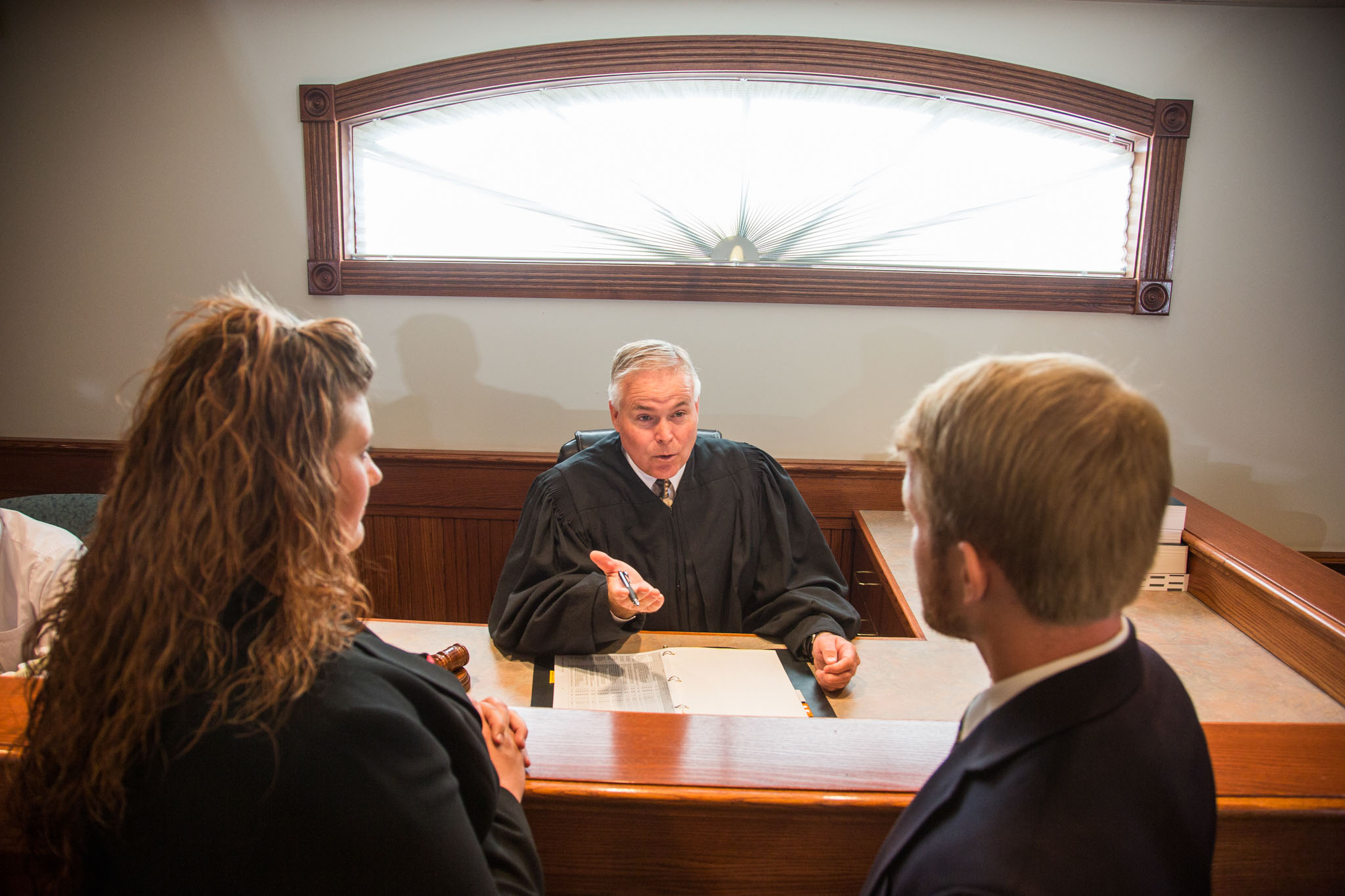 Judge speaking with people