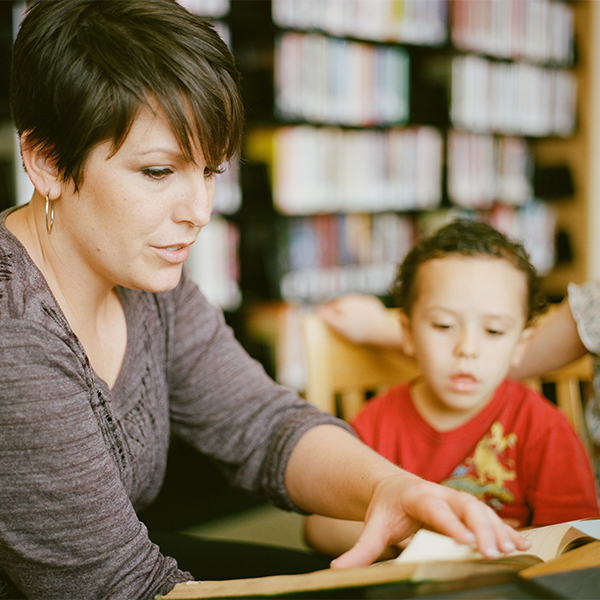 woman helping a child