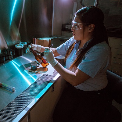 woman doing forensic work in a lab
