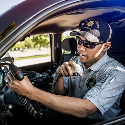 policeman talking through radio in his car