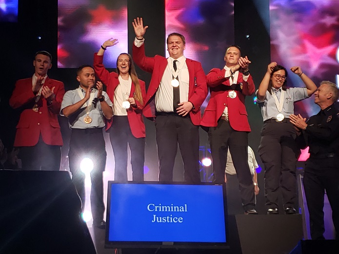 medal winners standing on stage at the national event