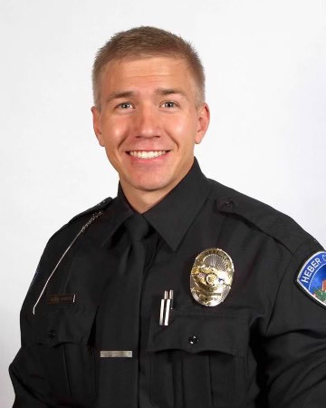 Causasian male police officer - Bryan Bowers