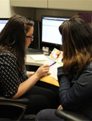 image of 2 women working at a desk