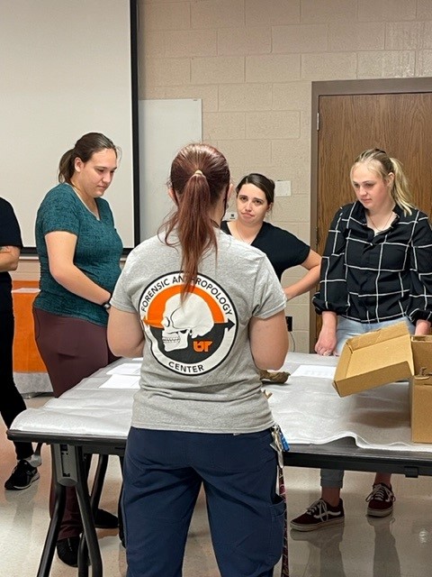 Instructor teaching three female students