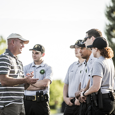 group of officer trainies listening to an instuctor