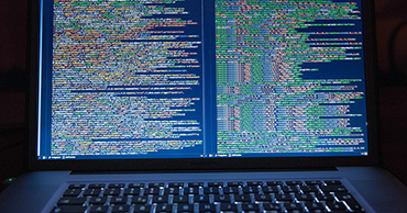 close up of lines of code on a blue screen