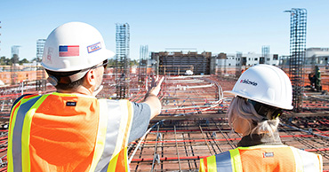 two men in hi-vis vests