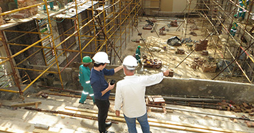 two men overseeing construction