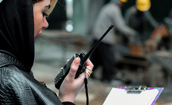 woman holding a radio