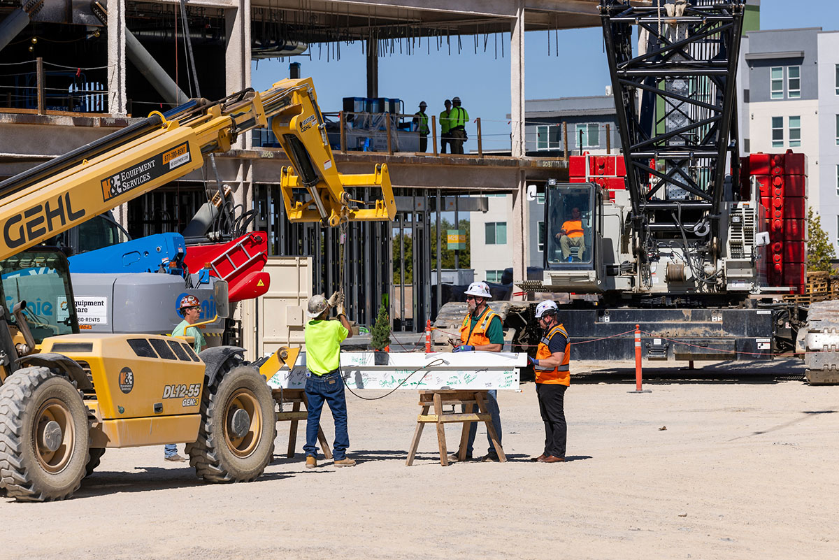Construction site with various workers and machinery