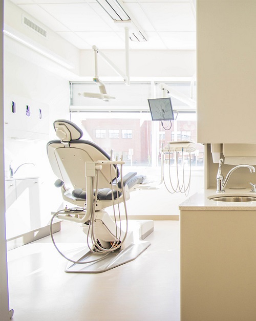 A picture of an empty dental chair from the back